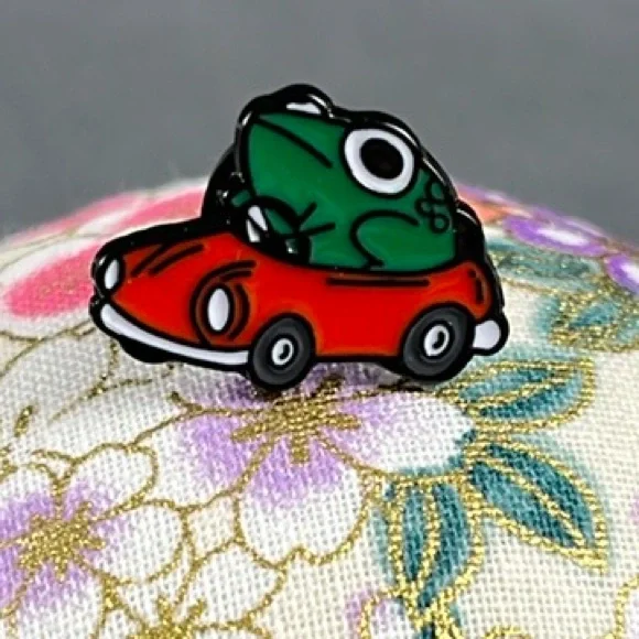 1/2 Inch Frog Driving a Red Car Enamel Pin - Picture 1 of 4